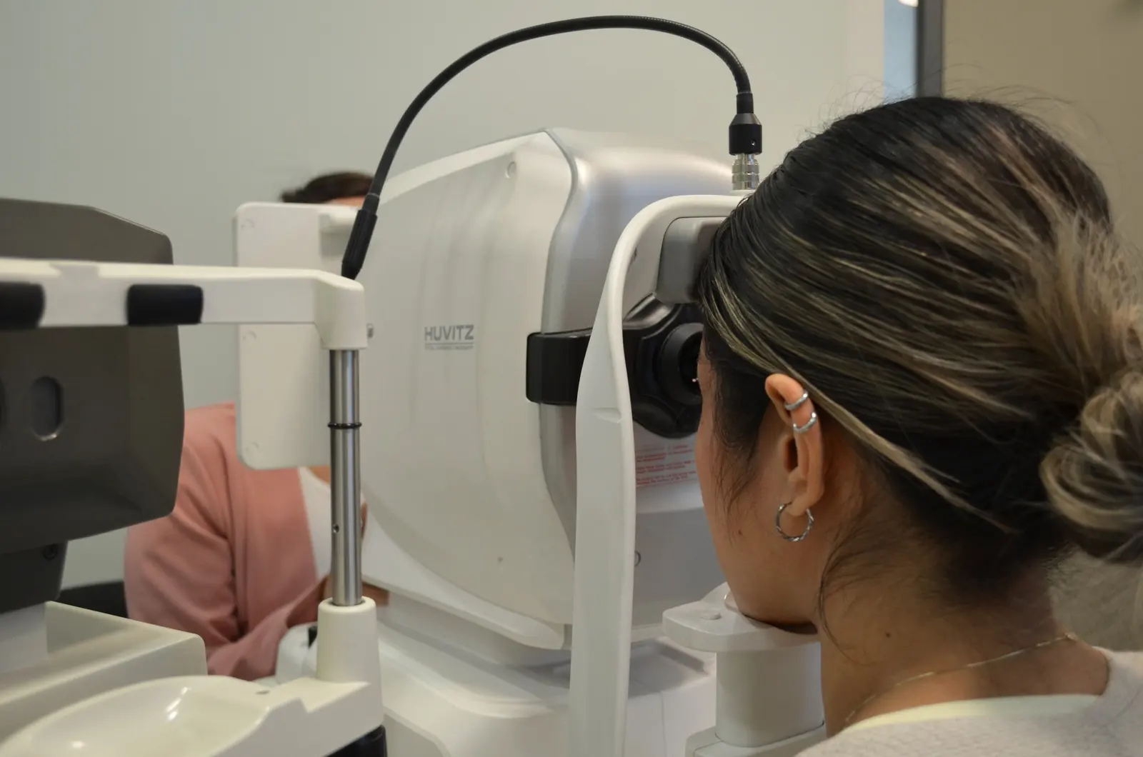 A patient has retinal photos taken during the preliminary tests at The EyeSite