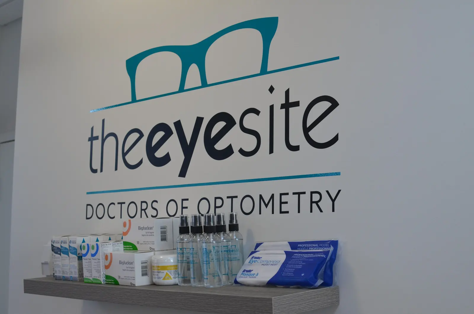 The EyeSite Doctors of Optometry logo on the clinic wall
